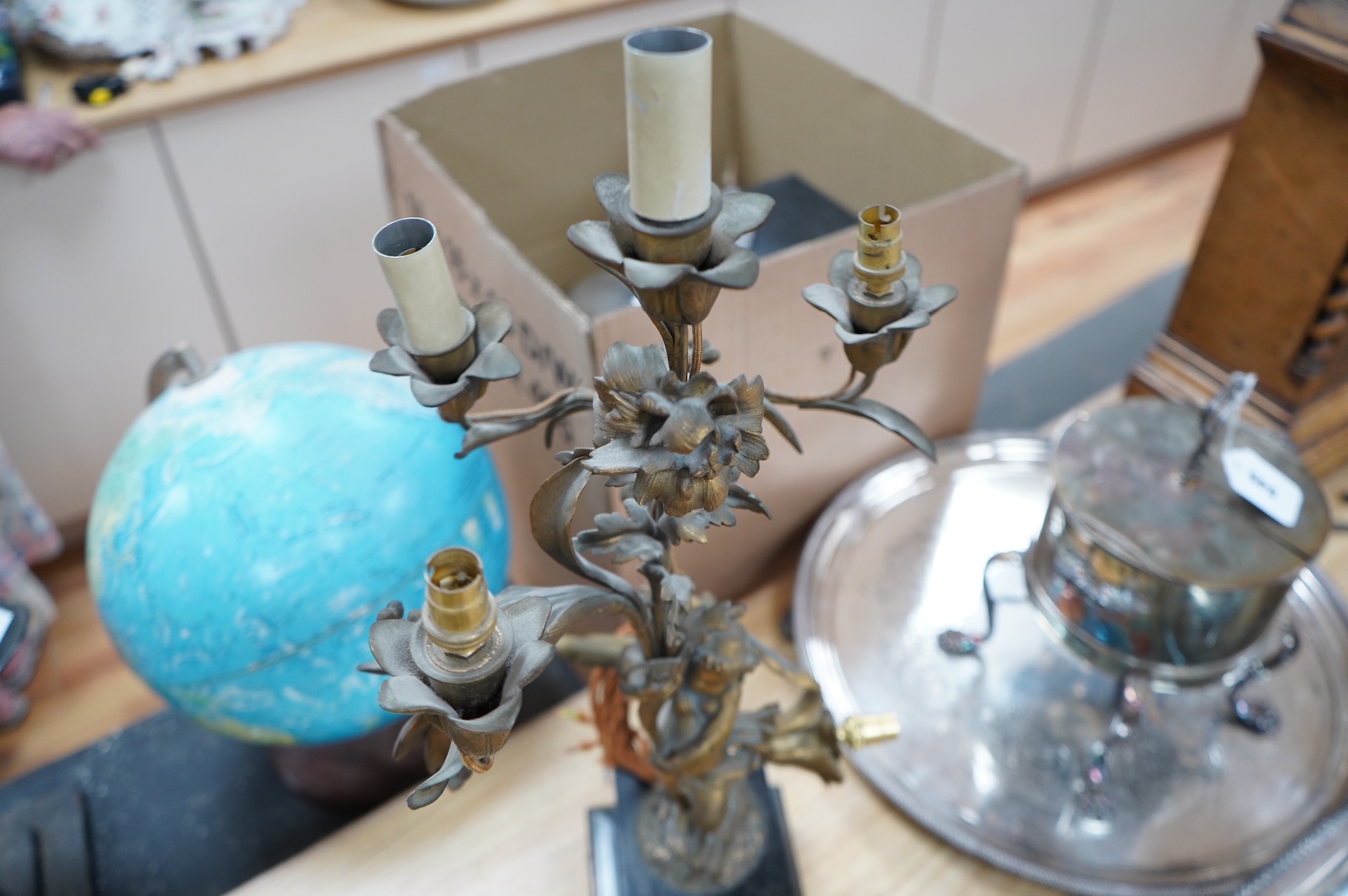 An early 20th century ormolu and marble ‘cherub’ converted candelabra and a brass desk stand, tallest 56cm